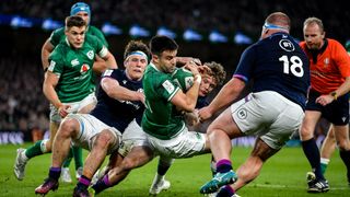 Conor Murray of Ireland is tackled by Rory Darge of Scotland during the Guinness Six Nations Rugby Championship