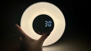 hOmeLabs Sunrise Alarm Clock with digital time on screen and ring light.