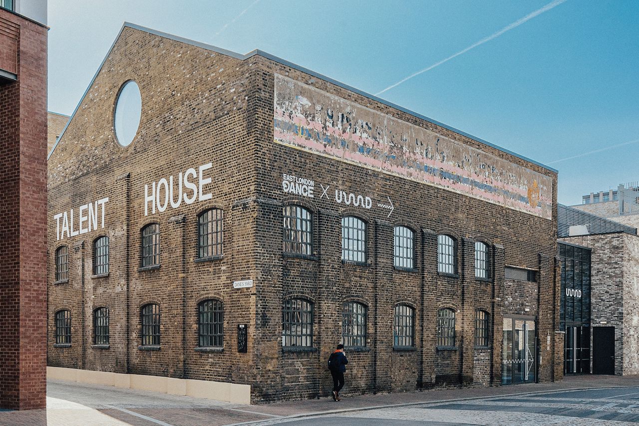 Exterior of talent house in east london against blue skies