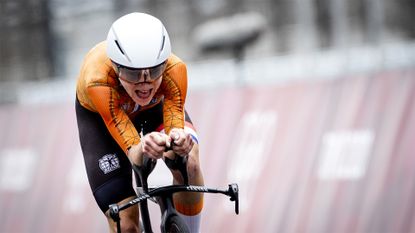 Annemiek van Vleuten crosses the finish line to win gold in the women's time trial at the Tokyo Olympics.