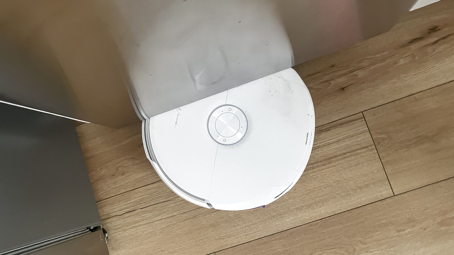 Narwal Freo 20 robot vacuum on a kitchen floor
