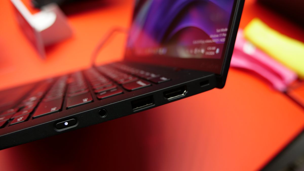 Images of the Lenovo ThinkPad X1 Carbon Gen 13 Aura Edition on a red table at IFA 2024