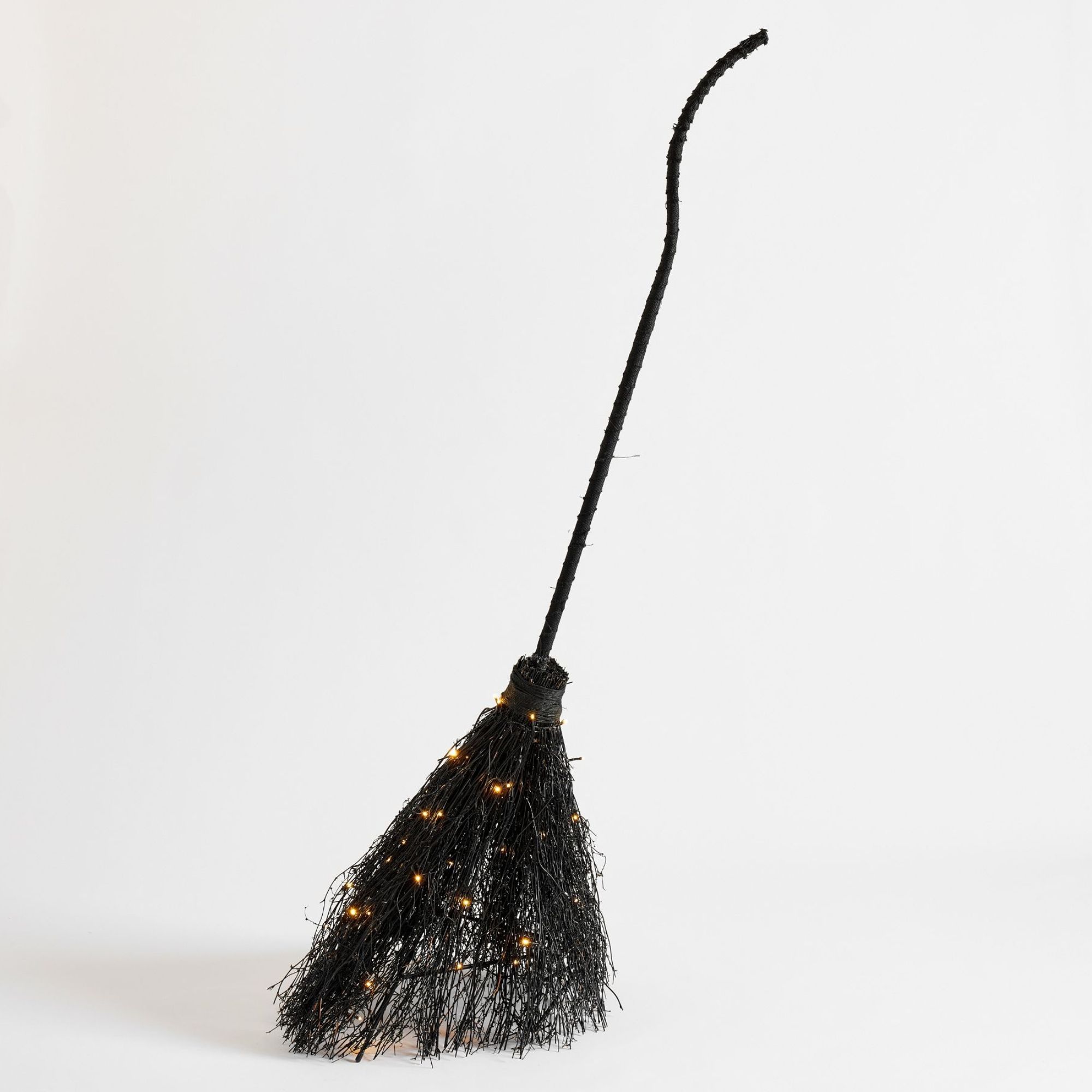 Witches broomstick decoration with fairy lights