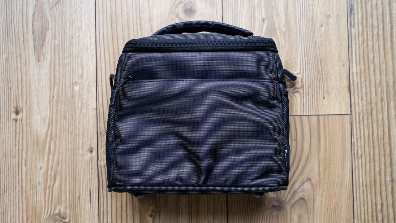 Potensic Atom SE Fly More carry bag on a wooden floor
