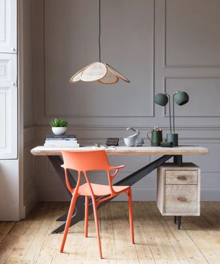 Home office with orange chair