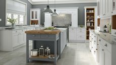 A white farmhouse-style kitchen with grey kitchen island 