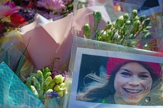 A picture of Sarah Everard sits amongst flowers left at the bandstand, Clapham Common