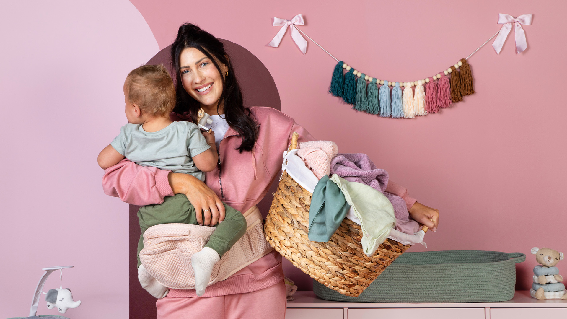 Becca Kufrin holding her child.