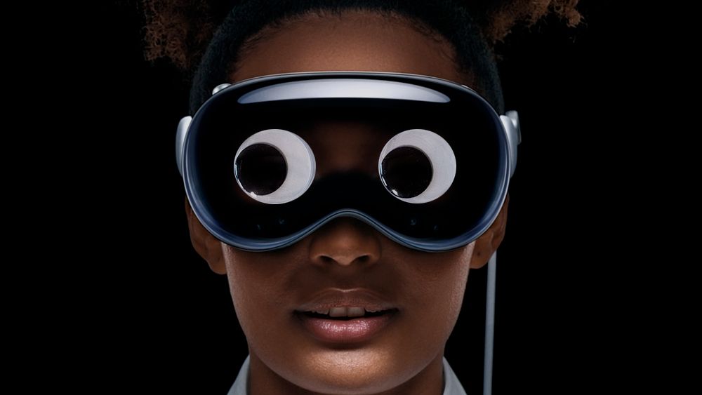 An Apple Vision Pro headset with googly eyes