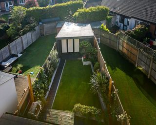 garden area with plants and wooden fence