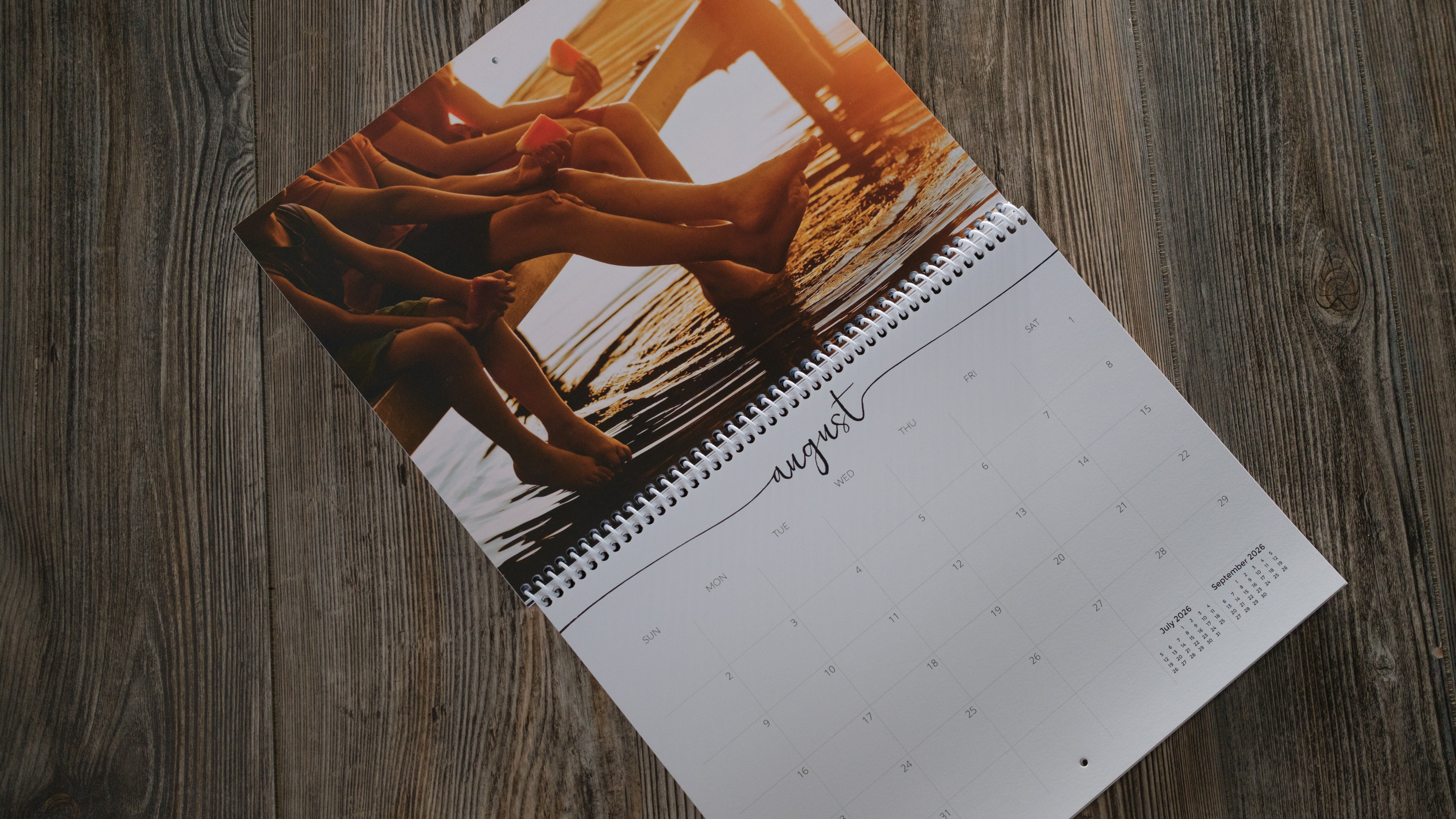 A photo calendar from Nations Photo Lab on a wood background