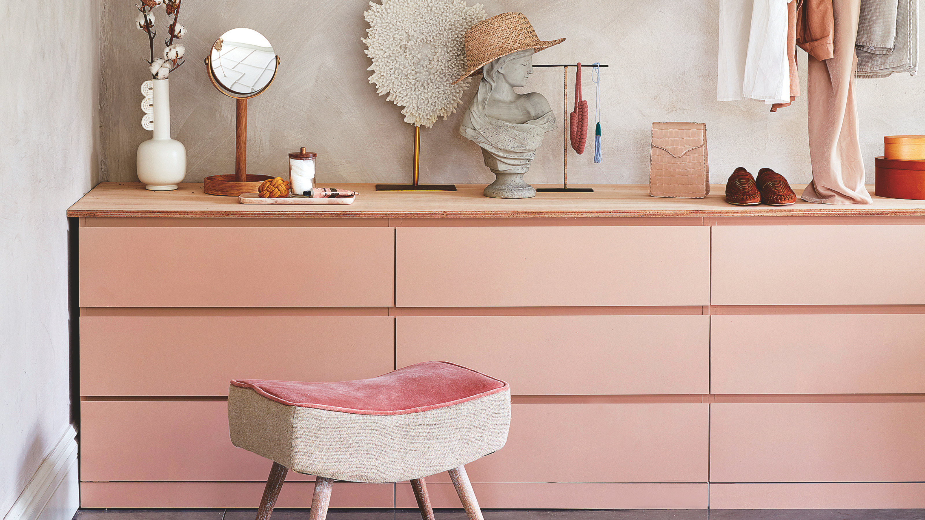 IKEA MALM drawers painted pink in a dressing room.