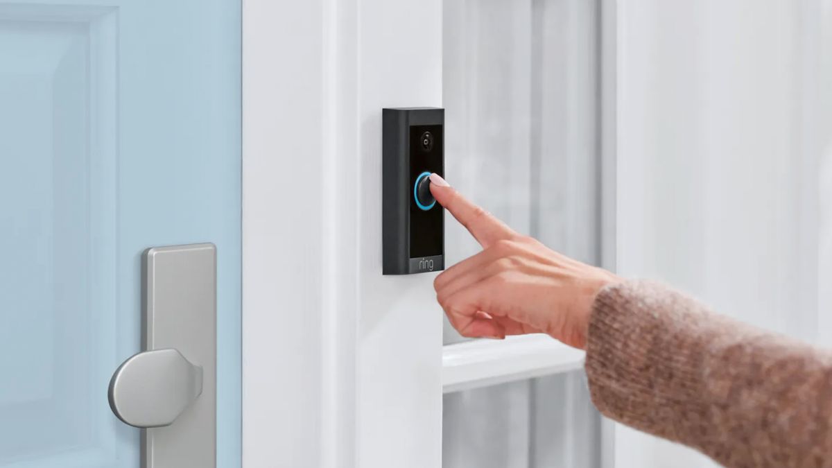 Person pressing Ring video doorbell button