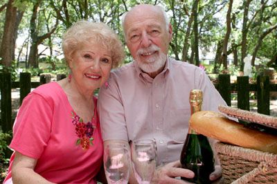 A senior couple enjoying a picnic in the park.