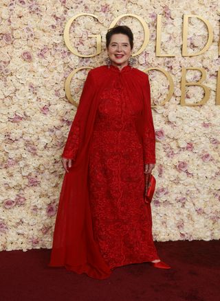 Celebrity wears a dark red dress to the Golden Globes 2025.