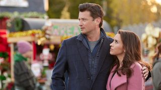 Lacey Chabert and Wes Brown look on in Haul Out the Holly: Lit Up