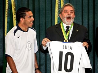 Brazil president Lula da Silva receives a Corinthians shirt from Carlos Tevez in 2005.