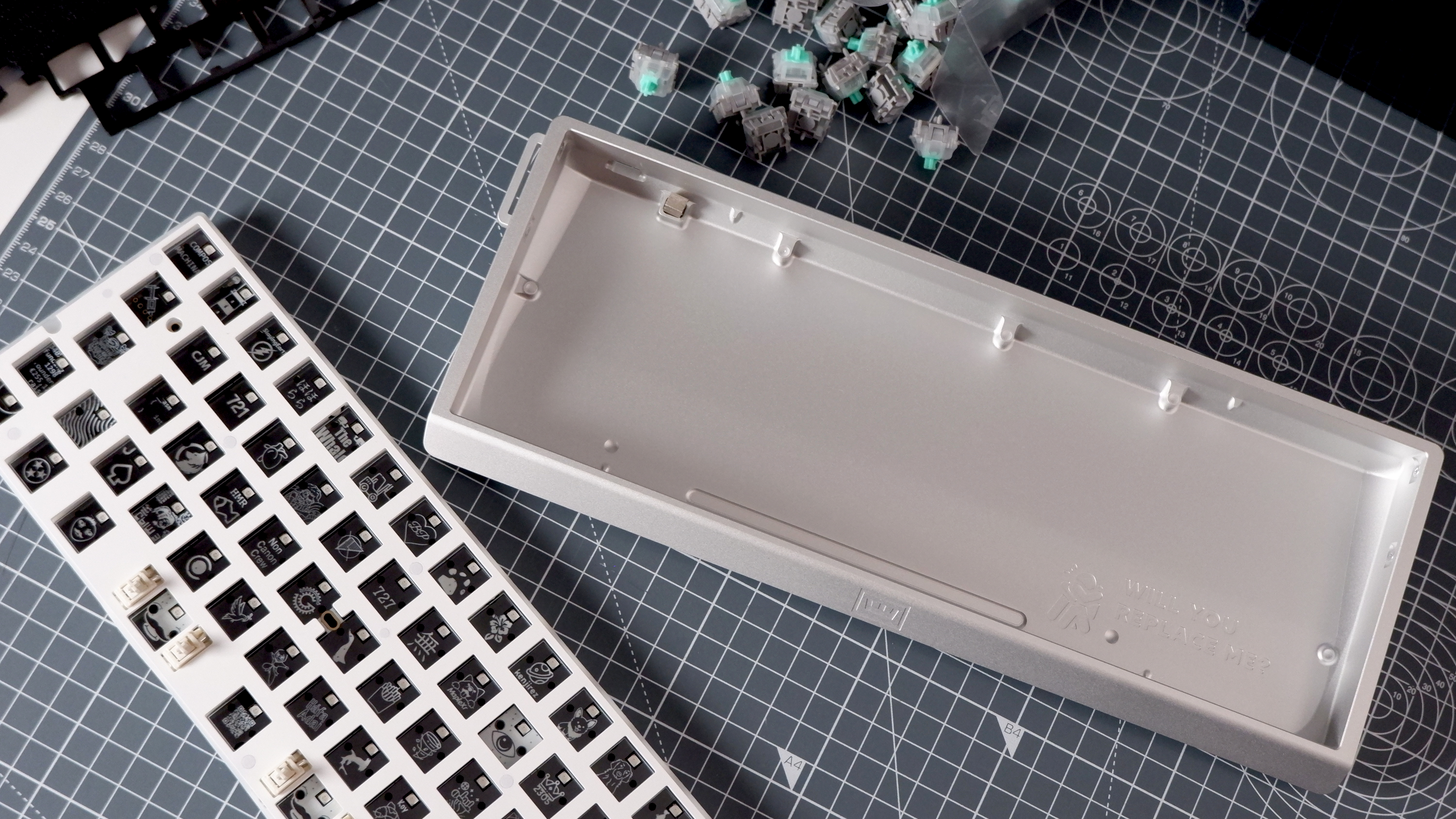 The Wooting 60HE v2 at various stages of being built.