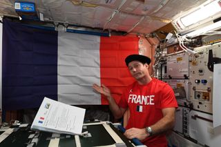 French astronaut Thomas Pesquet of the European Space Agency celebrated France's Bastille Day holiday in space with festive shirts and a meal with friends on July 14, 2021 aboard the International Space Station.