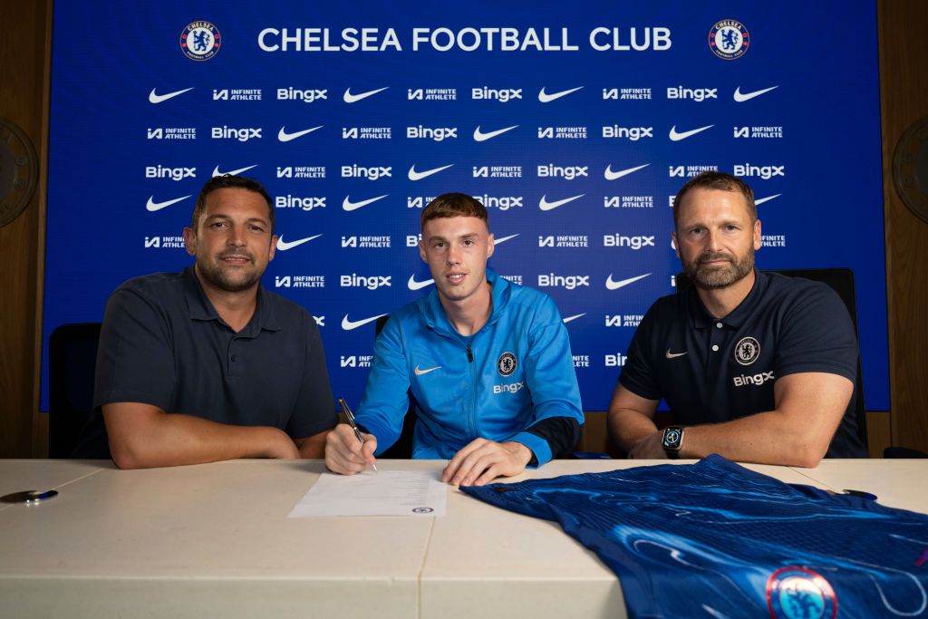 COBHAM, ENGLAND - AUGUST 13: Co Sporting Director Laurence Stewart, Cole Palmer and Co Sporting Director Paul Winstanley during the announcement of Cole Palmer signing a new contract at Chelsea Training Ground on August 13, 2024 in Cobham, England. (Photo by Darren Walsh/Chelsea FC via Getty Images)