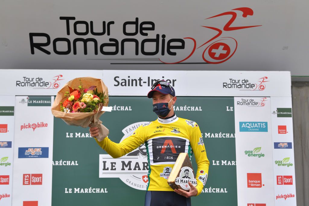 SAINTIMIER SWITZERLAND APRIL 29 Rohan Dennis of Australia and Team INEOS Grenadiers Yellow Leader Jersey celebrates at podium during the 74th Tour De Romandie 2021 Stage 2 a 1657km stage from La Neuveville to SaintImier Flowers Cheese Trophy Mask Covid Safety Measures TDR2021 TDRnonstop UCIworldtour on April 29 2021 in SaintImier Switzerland Photo by Luc ClaessenGetty Images