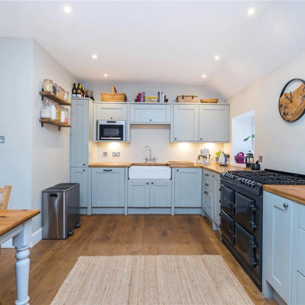 blue kitchen with wooden floor