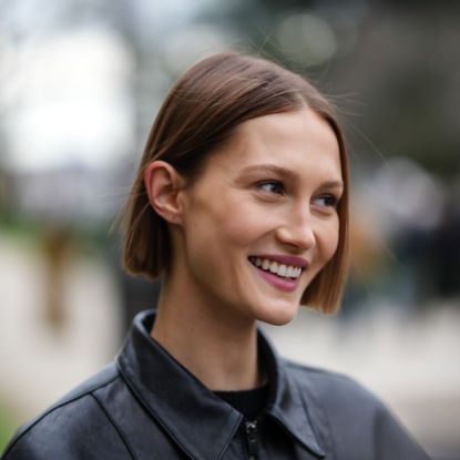 street style shot of a model with clear and glowy skin - best night cream