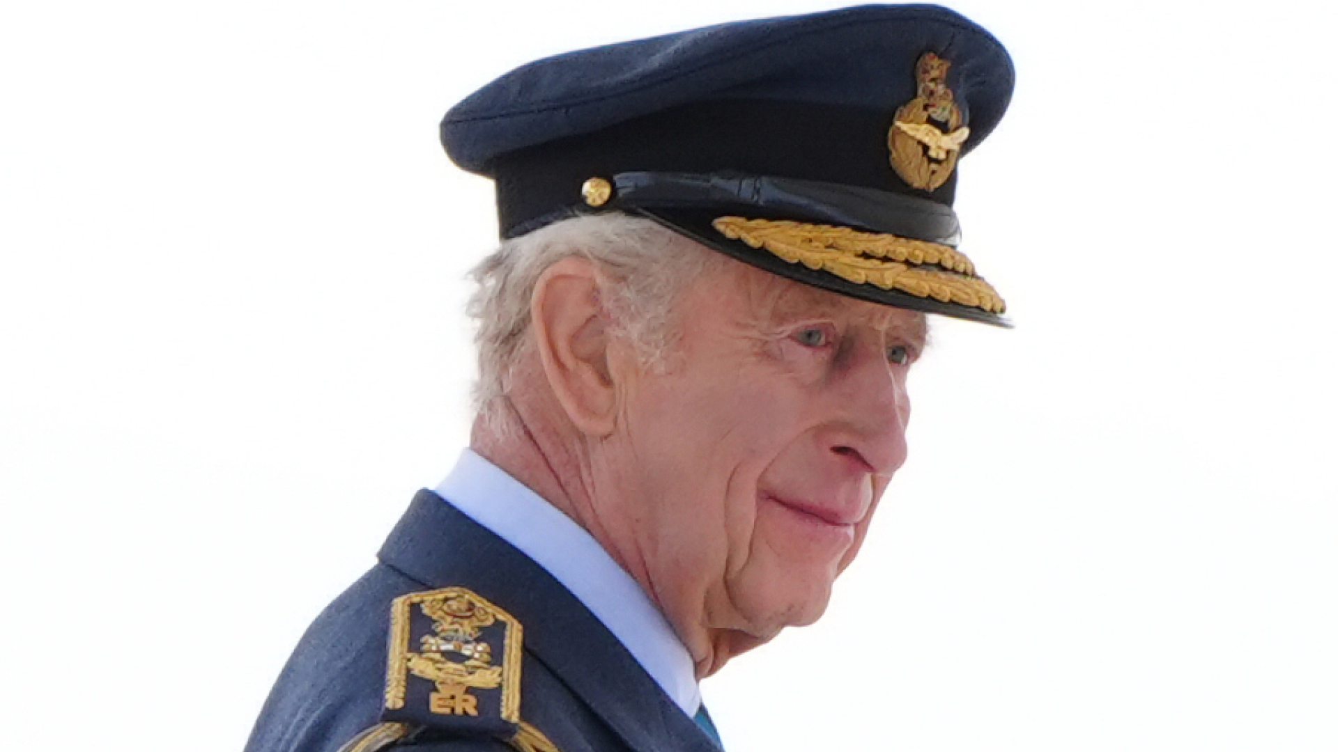 King Charles wearing a blue military uniform