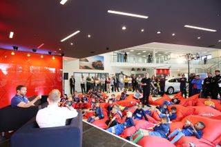 Gareth Southgate speaking to young fans during a Q&A at a Vauxhall dealership in 2017