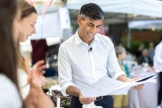 Rishi Sunak talking to young adults about numbers