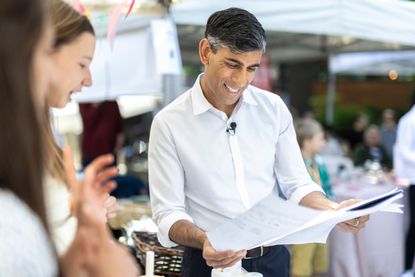 Rishi Sunak talking to young adults about numbers