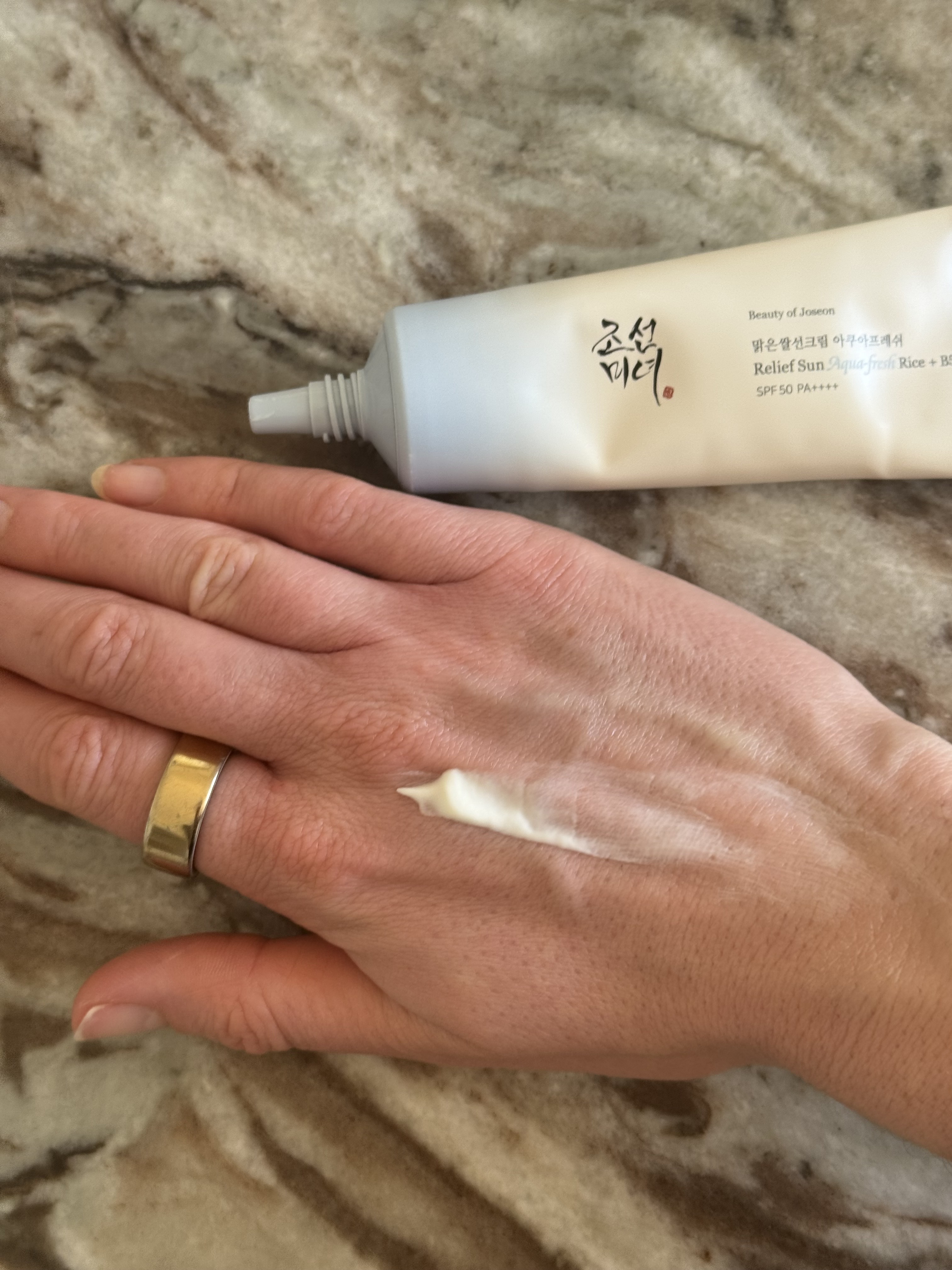 A swatch of the Beauty of Joseon Relief Sun Aqua Fresh SPF 50 + B5 SPF on Eleanor's hand