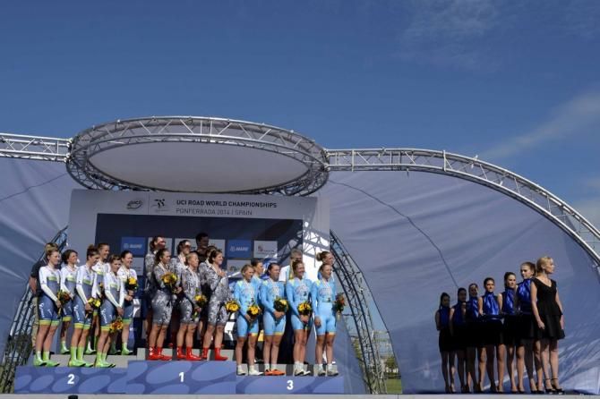 The podium pauses for the national anthem