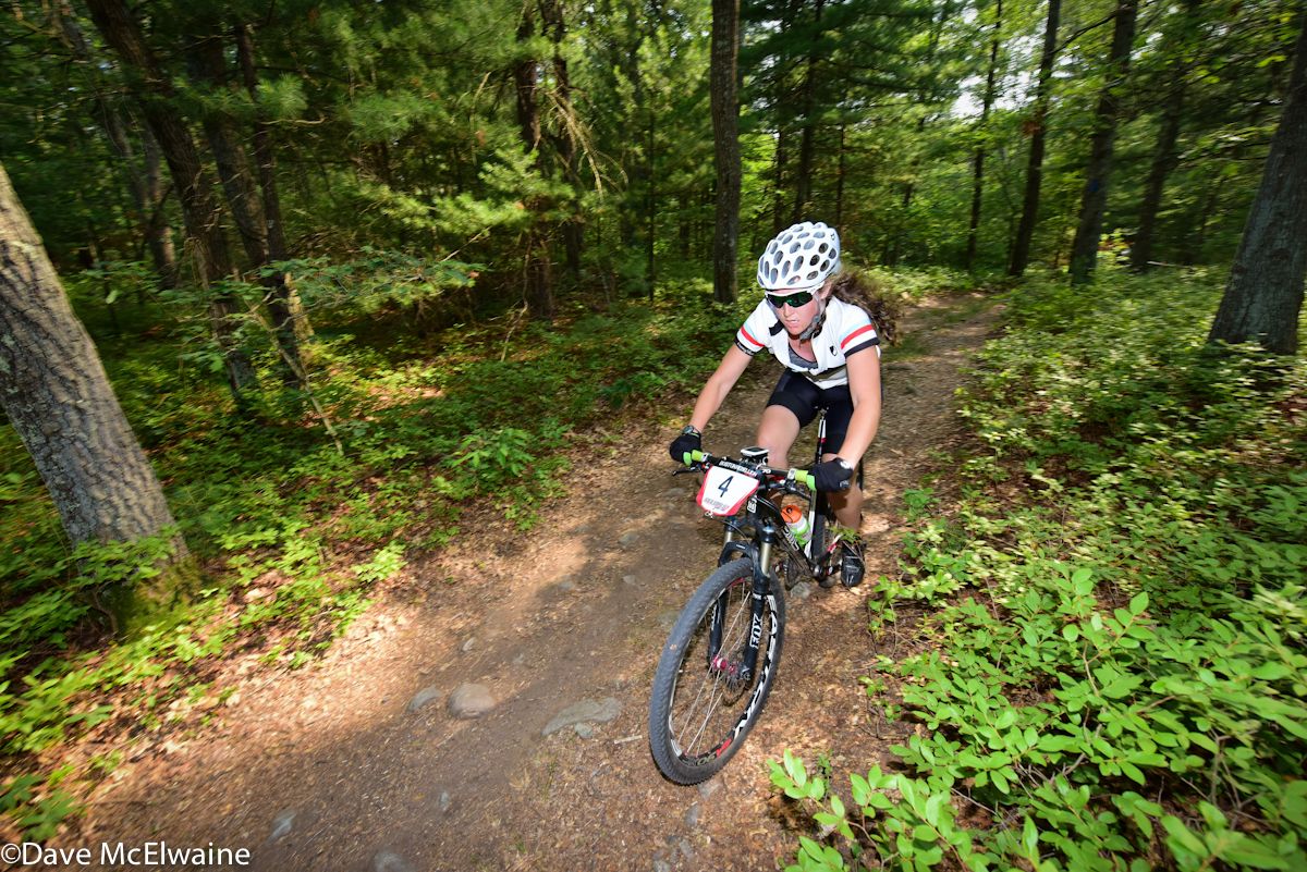 Catherine Harnden riding at the back of the pack on lap two