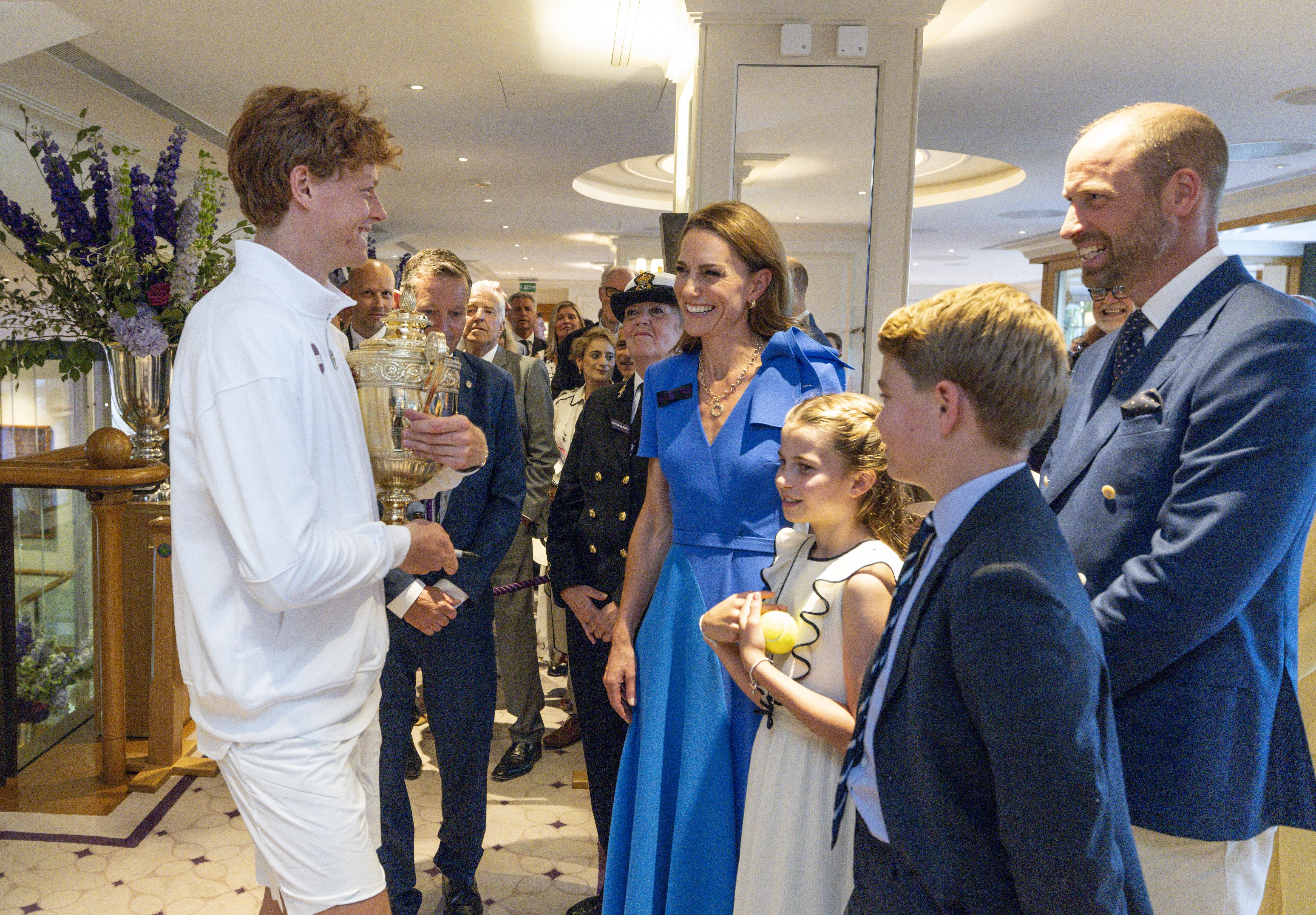 Jannik Sinner talking to Princess Kate, Prince George, Princess Charlotte and Prince William at Wimbledon 2025