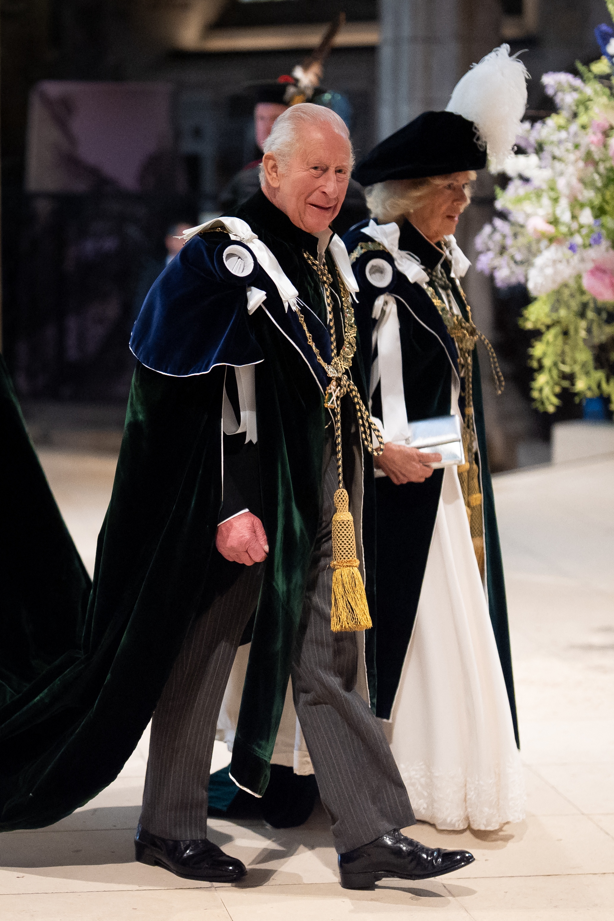 King Charles and Queen Camilla wearing velvet capes