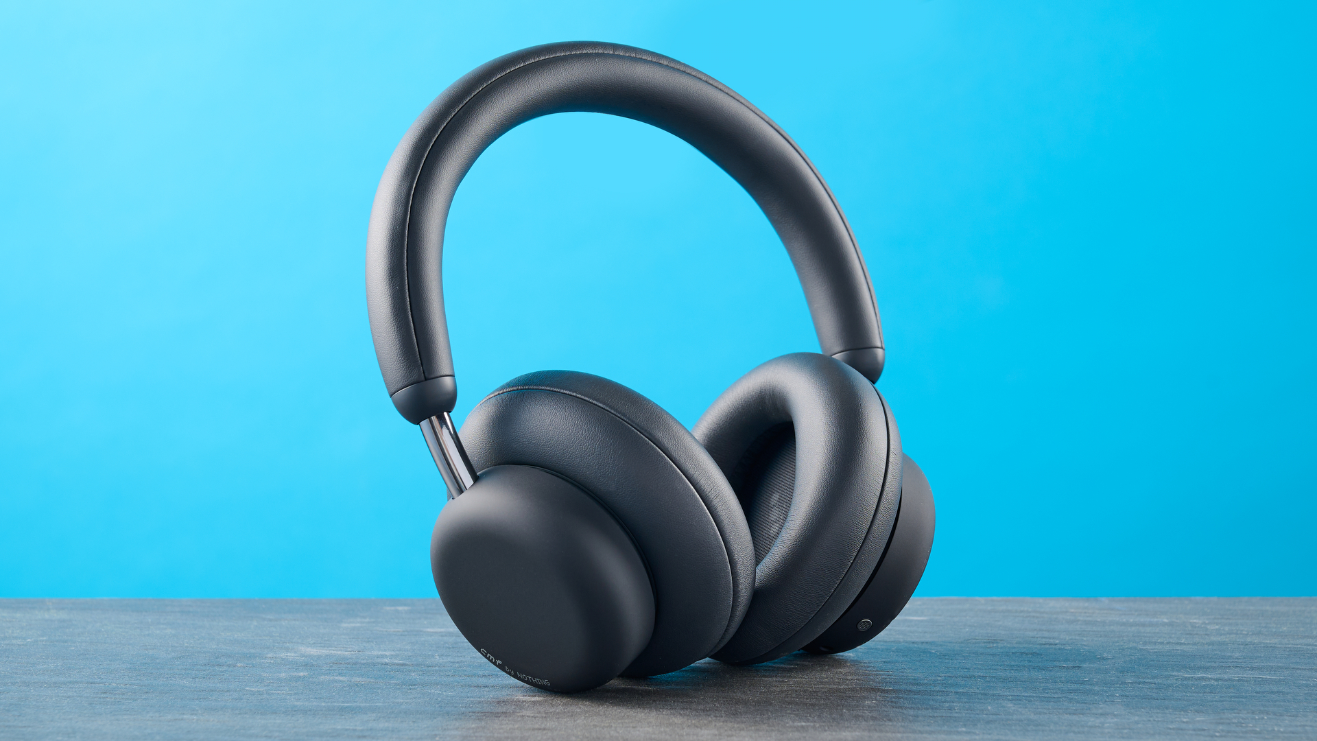 the cmf headphone pro / cmf by nothing headphone pro / nothing headphone pro in black photographed against a blue tom's guide background