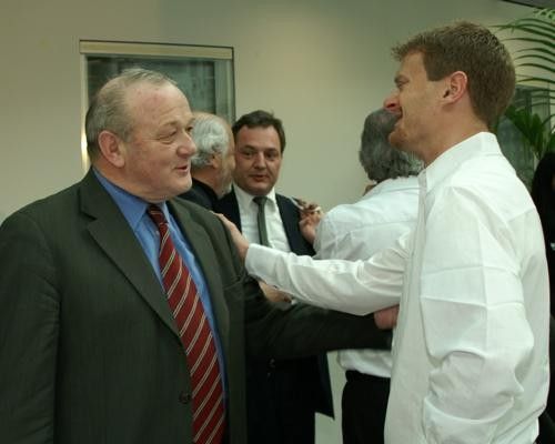 Floyd Landis (right), talking to former Tour de France director Jean-Marie Leblanc.
