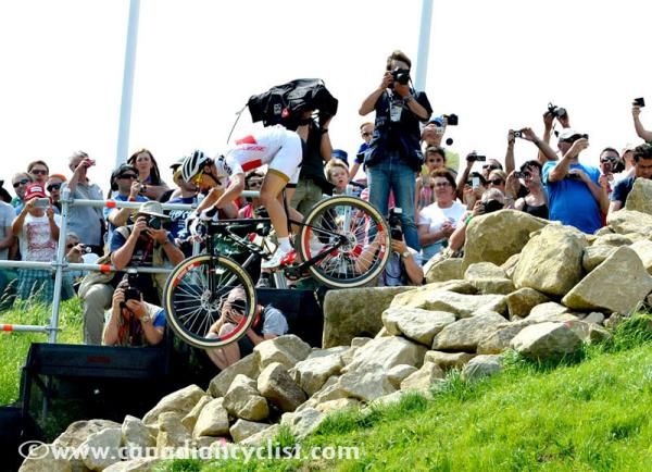 Nino Schurter (Switzerland) flies over some rocks