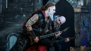 Dimmu Borgir's guitarists shredding on stage