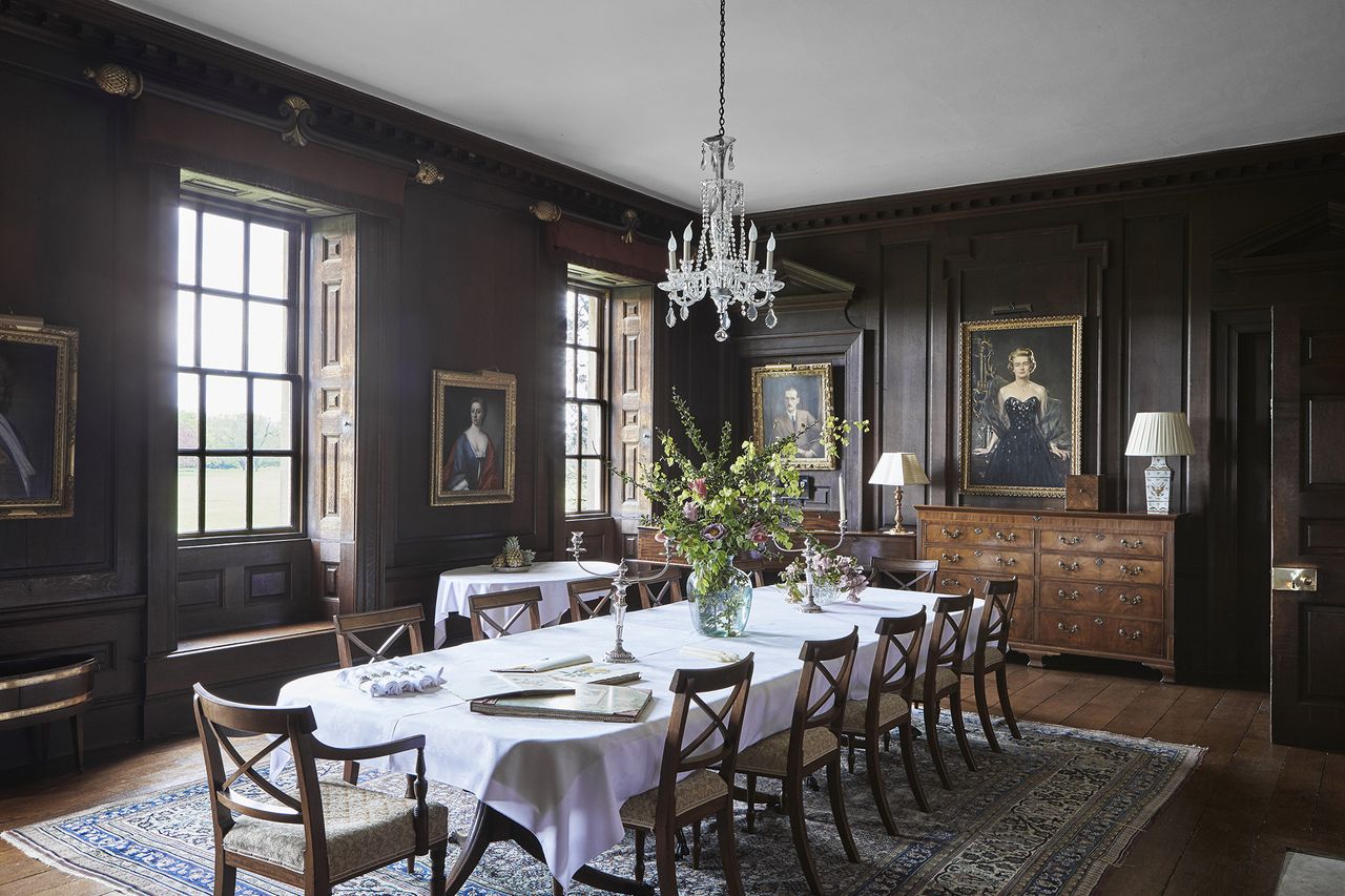 formal dining room with dark wood panels in a Georgian home