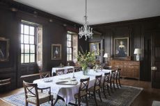 formal dining room with dark wood panels in a Georgian home