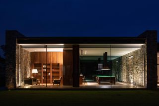 The library and billiards room seen from the lawn at Tinderbox House by Studio Ilk Architecture