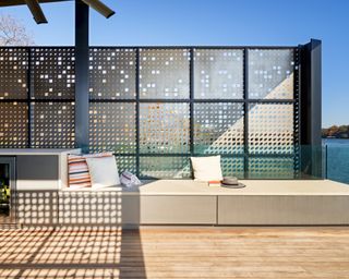 part of the built in furniture at the deck of the Filtered Frame Dock boathouse by Matt Fajkus Architecture