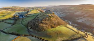 Aerial vista by drone of Carreg Cennen Castle,