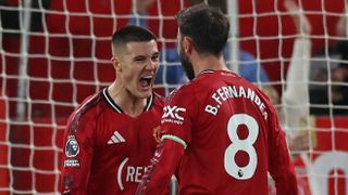 Benjamin Sesko celebrates with Bruno Fernandes after scoring Manchester United's second goal against Brentford at Old Trafford
