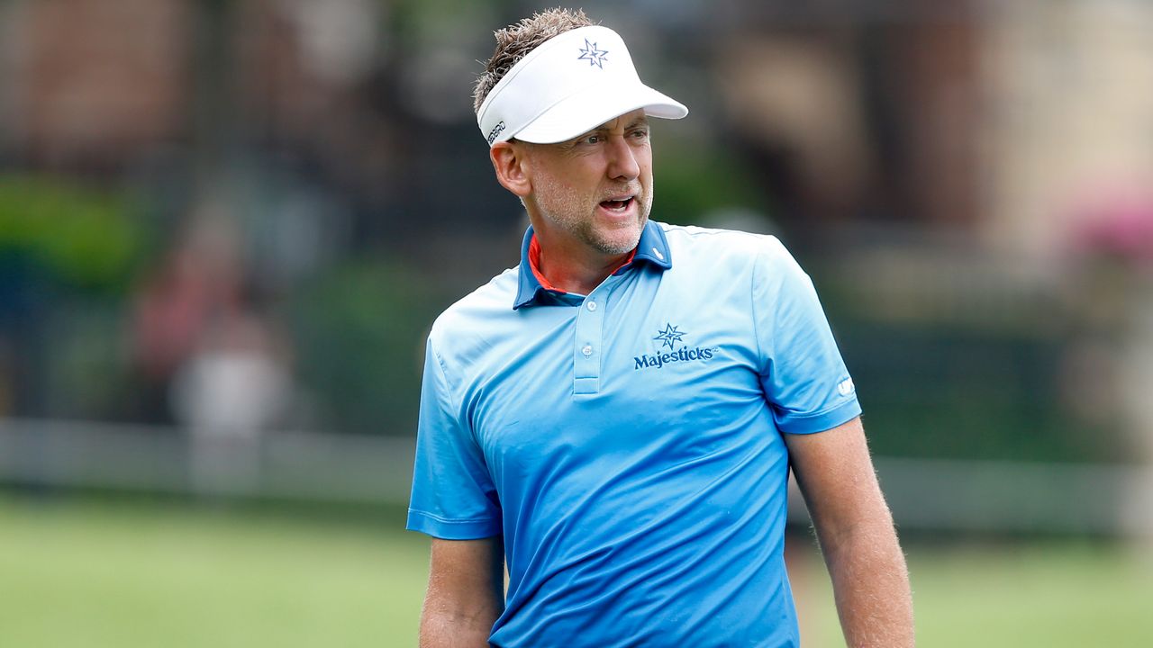 Ian Poulter looks on after hitting an iron shot