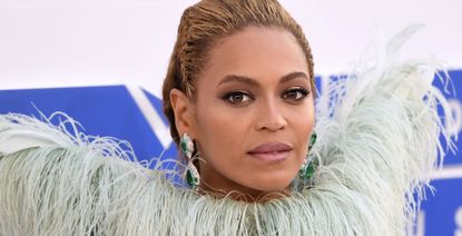 Beyonce attends the 2016 MTV Video Music Awards in a feathered naked dress