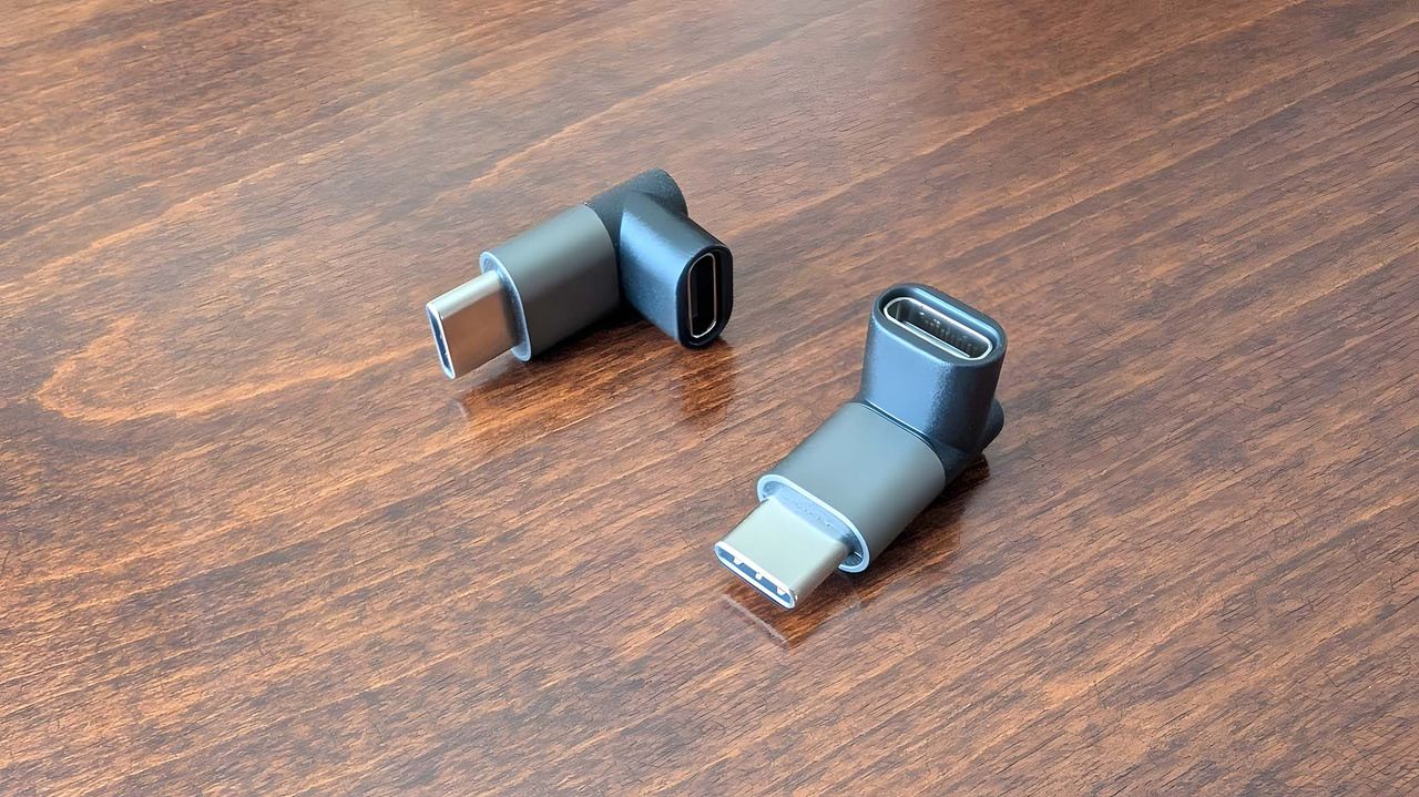 Two JSAUX USB-C right-angle adapters on table.