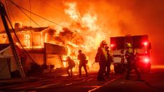 Firefighters battle the Palisades Fire in Los Angeles' Pacific Palisades on Jan. 7, 2025.